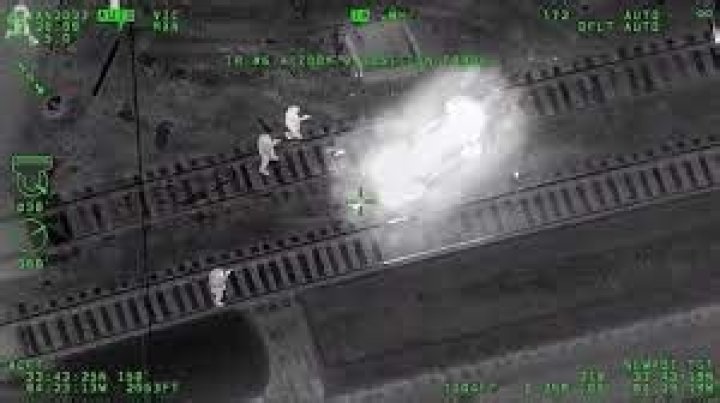 Atlanta officer pulls man from stolen patrol car seconds before train hits