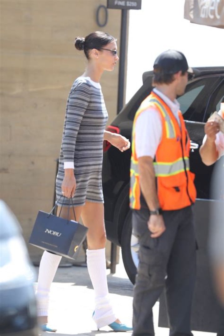 Bella Hadid Wore a Mini Dress With Leg Warmers