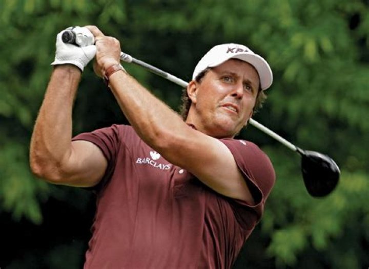 Consistency pleases Woods despite Mickelson victory