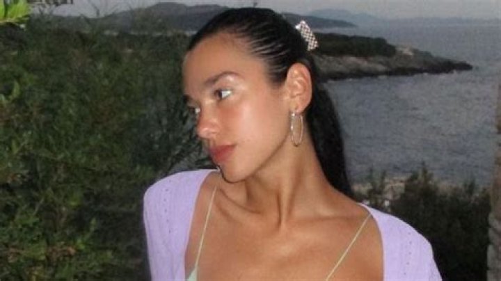 Dua Lipa's Plunging Slinky Slip Dress Is a Masterclass in Vacation Dressing
