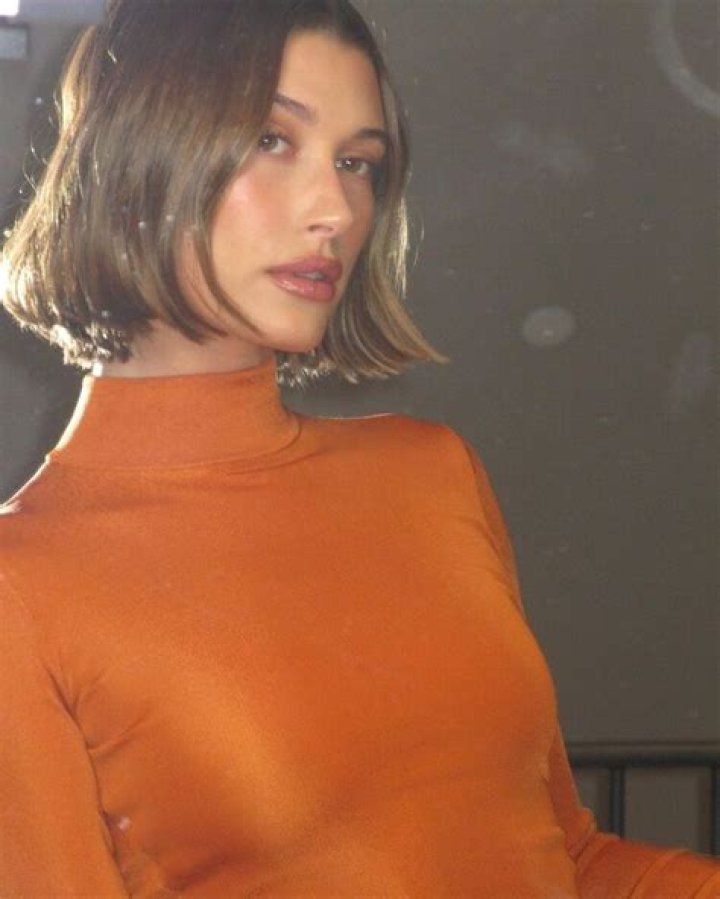 Hailey Bieber Debuted an Even Shorter Bob While Dressed in Head-to-Toe Orange