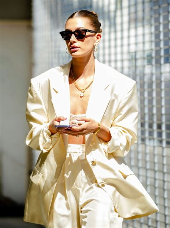 Hailey Bieber Wore a Jacquemus Cardigan With Plaid Trousers