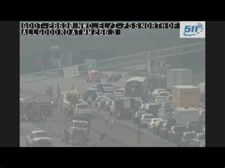 Overhead sign structure collapses onto I-75 after crash involving dump truck