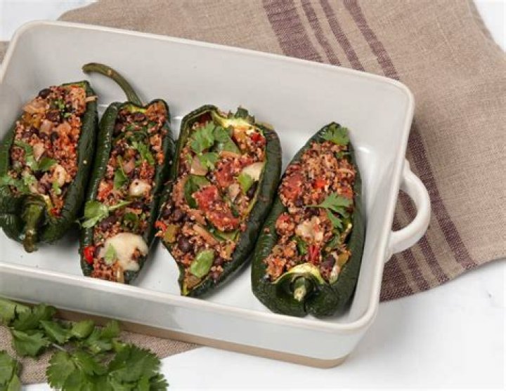 Tex-Mex Stuffed Poblanos with Manchego Sauce and Black Beans with Roasted Garlic
